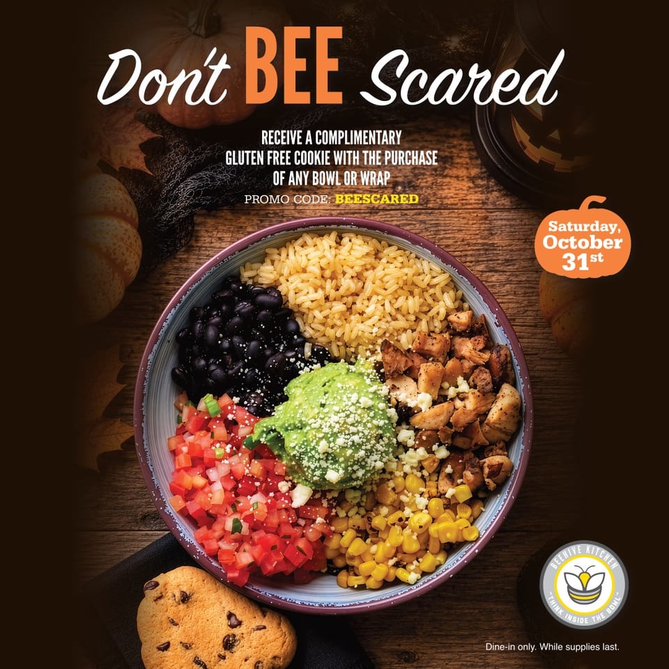 Promotional graphic featuring a colorful rice bowl, chocolate chip cookie, pumpkins, and text advertising a complimentary gluten-free cookie.