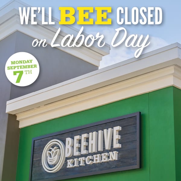 Beehive Kitchen storefront announces closure on Labor Day, Monday September 7, with its logo displayed on a green wall.