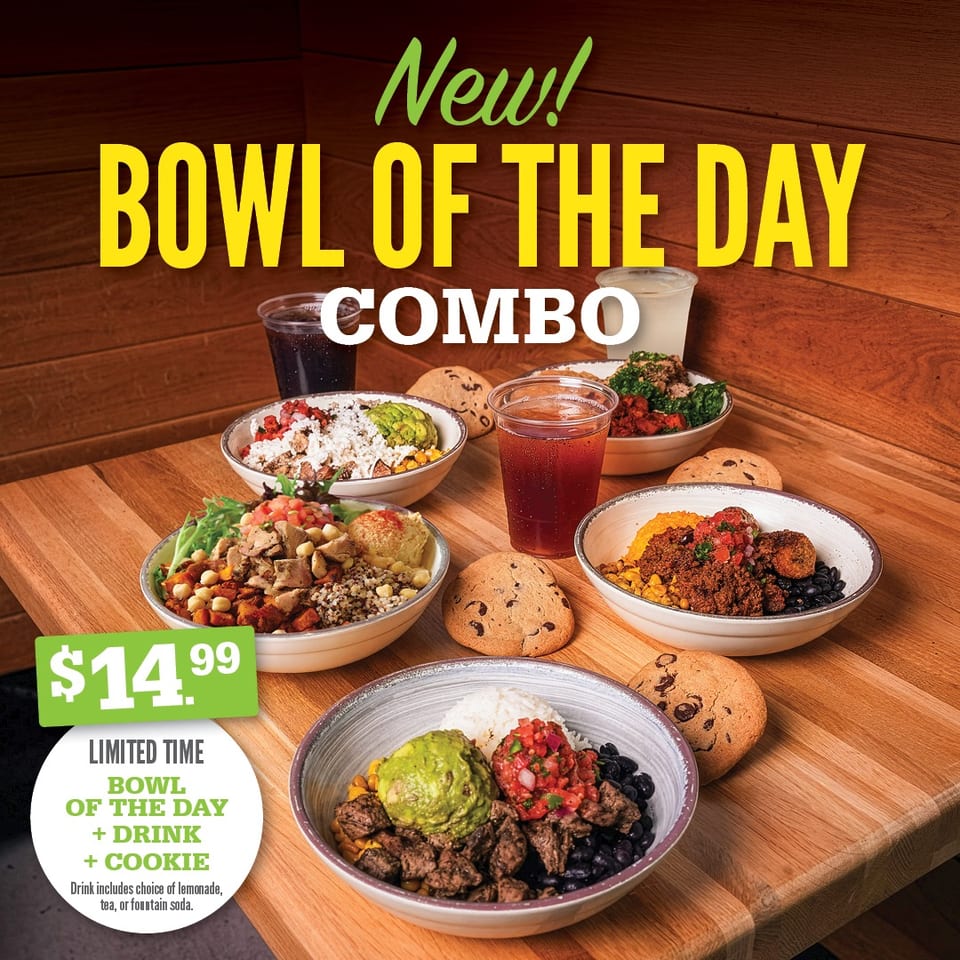 Promotional display of colorful rice bowls, drinks, and chocolate chip cookies on a wooden table advertising a limited-time bowl combo.